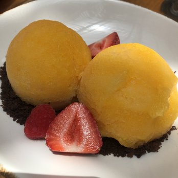 INTI Beach - Maracuya (passionfruit) sorbet served with fresh berries and cocoa grains. Refreshing for a hot summer day! - Peruvian Near Me - Playa del Carmen, ROO