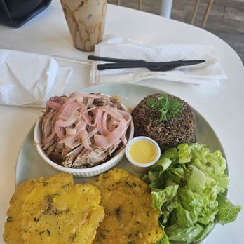 1928 Cuban Bistro - Riverside - roasted pork with pickled onionsLa Nani (Iced Caf Con Leche) Tostones Side of rice & black bean mixture - Coffee & Tea Near Me - Jacksonville, Florida 1928 Cuban Bistro - Riverside - roasted pork with pickled onionsLa Nani (Iced Caf Con Leche) Tostones Side of rice & black bean mixture - Coffee & Tea Near Me - Jacksonville, Florida