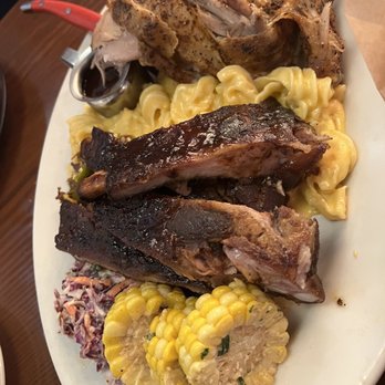 Sharps Roasthouse - Combo: smoked ribs, pulled pork, smoked chicken, Mac, slaw, corn. - American Near Me - SeaTac, Washington Sharps Roasthouse - Combo: smoked ribs, pulled pork, smoked chicken, Mac, slaw, corn. - American Near Me - SeaTac, Washington