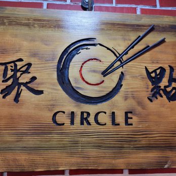 Circle Chinese Cuisine - a wooden sign with chopsticks on it - Cantonese Near Me - Kent, Washington