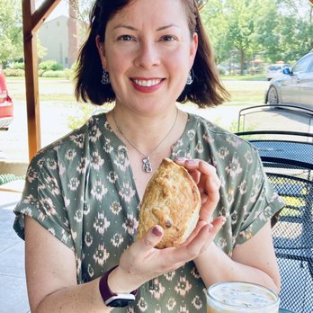 Walla Walla Roastery - a woman holding a sandwich and a drink - Coffee & Tea Near Me - Walla Walla, Washington Walla Walla Roastery - a woman holding a sandwich and a drink - Coffee & Tea Near Me - Walla Walla, Washington
