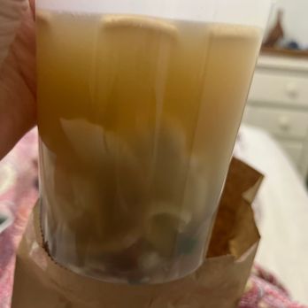 Canton Rose - a person holding a plastic cup filled with liquid - Chinese Near Me - Miami, Florida