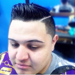 Cutmasters Barbershop - Combover with fade and part. Text for appointment 718-413-3277