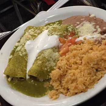 Mucho Wraps - Two Chicken Enchilada verde ($8.90) - served with rice, refried beans, sour cream, lettuce, and tomatoes. - Mexican Near Me - Moraga, California Mucho Wraps - Two Chicken Enchilada verde ($8.90) - served with rice, refried beans, sour cream, lettuce, and tomatoes. - Mexican Near Me - Moraga, California
