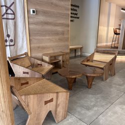 Akihi - More seating arrangements. In the upper right corner, there's a bar with chairs.