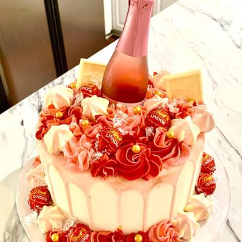 Cakes to Remember - a bottle of champagne on top of a cake - Custom Cakes Near Me - Naxera, Virginia Cakes to Remember - a bottle of champagne on top of a cake - Custom Cakes Near Me - Naxera, Virginia