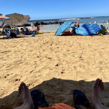 Poipu Beach - Relaxing. Thank goodness we rented chairs an an umbrella from across the street. - Beaches Near Me - Koloa, Hawaii Poipu Beach - Relaxing. Thank goodness we rented chairs an an umbrella from across the street. - Beaches Near Me - Koloa, Hawaii