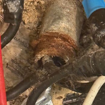 MDC Electric - Closeup of metal pipe coming out of cement foundation - Electricians Near Me - Panama City, Florida