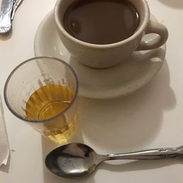 Juice and coffee with breakfast special. Spoon added for size comparison