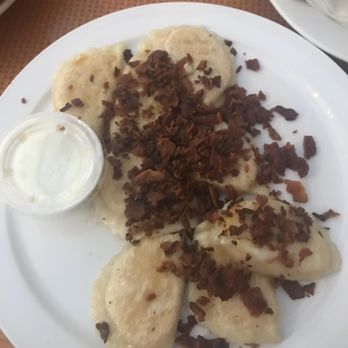 Falls Manor Motel & Restaurant - Pierogis with Sour cream and bacon - Hotels Near Me - Niagara Falls, Ontario Falls Manor Motel & Restaurant - Pierogis with Sour cream and bacon - Hotels Near Me - Niagara Falls, Ontario