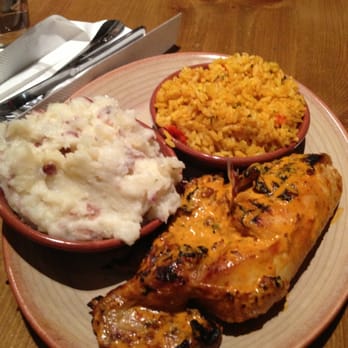 Nando's Peri-Peri - Hot Peri-Peri Chicken with Red Skin Mashed Potatoes and Portuguese Rice - Portuguese Near Me - Silver Spring, Maryland Nando's Peri-Peri - Hot Peri-Peri Chicken with Red Skin Mashed Potatoes and Portuguese Rice - Portuguese Near Me - Silver Spring, Maryland