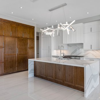 Eurofloors - Kitchen Island with Waterfall Legs, Kitchen counter and full backsplash. - Flooring Near Me Eurofloors - Kitchen Island with Waterfall Legs, Kitchen counter and full backsplash. - Flooring Near Me