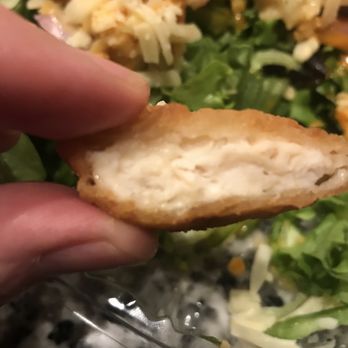 Village Pizza - a hand holding a piece of bread - Pizza Near Me - Ledyard, Connecticut