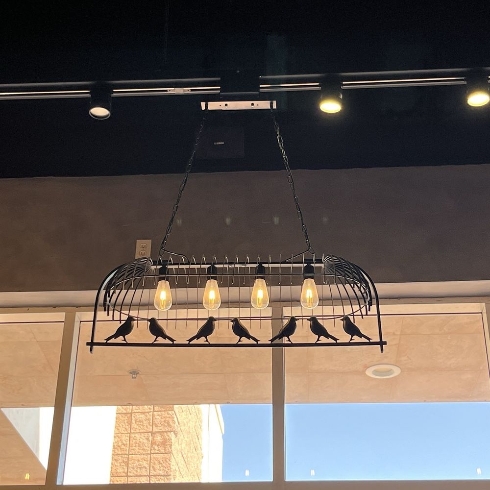 Changan Kitchen - Hanging lighting fixture adorned by metal birds design - Chinese Near Me - Ontario, California