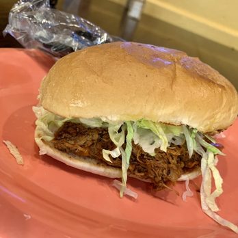 Bolillos Cafe - a pulled pork sandwich on a pink plate - Mexican Near Me - Laredo, Texas