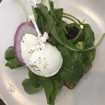 Petit Chou - Avocado toast with poached egg was flavorful. The dressed arugula was a nice touch. - Breakfast & Brunch Near Me - Atlanta, Georgia