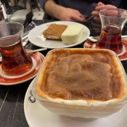 Burnt rice pudding, Turkish ice cream, some kind of firm sweet nougat dessert. Burnt rice pudding, Turkish ice cream, some kind of firm sweet nougat dessert.