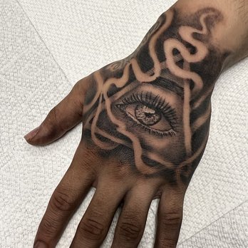 Tattoos by Arturo - Triangle pyramid eye tattoo on a hand that took 3.5 hours - Tattoo Near Me - Roselle, Illinois Tattoos by Arturo - Triangle pyramid eye tattoo on a hand that took 3.5 hours - Tattoo Near Me - Roselle, Illinois