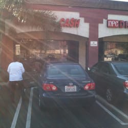 Checks 4 Cash - Front of building.That big tree is covering 90% of the business sign.