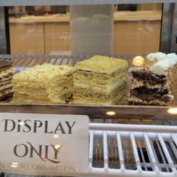 European Smak - Slices are for display and all of these cakes, baked by the owner, are available in "by the pound" size slices.  These are roughly 1/4 lb.