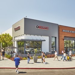 Shoppers walk near Chipotle and Bafang Dumpling outside Los Cerritos Center.