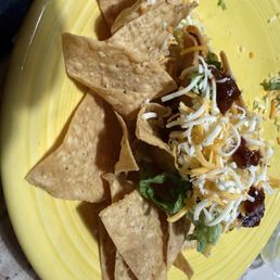 Crispy chicken taco with some salsa on it. Crispy chicken taco with some salsa on it.