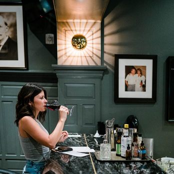 Parlor Bar - a woman drinking a glass of wine - Bars Near Me - Austin, Texas Parlor Bar - a woman drinking a glass of wine - Bars Near Me - Austin, Texas