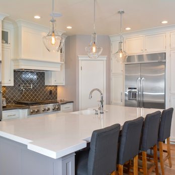 Jaureguy's Design and Construction - a kitchen with white cabinets and stainless steel appliances - Interior Design Near Me - Turlock, California Jaureguy's Design and Construction - a kitchen with white cabinets and stainless steel appliances - Interior Design Near Me - Turlock, California