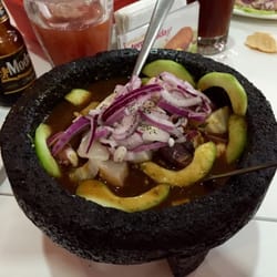 Mi Gusto Es - Molcajete. Great mix of raw and cooked shrimp, octopus, fish, etc. Filling for 1; great to share.