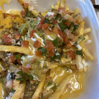 Epic Tacos - Half eaten epic fries with delicious homemade sauce. Get sauce on the side if you like crispy fries. - Caterers Near Me - Simi Valley, California
