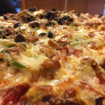 Bellacino's Pizza & Grinders - a close up of a pizza - Pizza Near Me - Simpsonville, South Carolina
