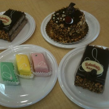 Schubert's Bakery - Petit-fours: Passion-fruit, Lemon, Strawberry. Top l to r: Opera, Chocolate mousse with Almond - Bakeries Near Me - San Francisco, California Schubert's Bakery - Petit-fours: Passion-fruit, Lemon, Strawberry. Top l to r: Opera, Chocolate mousse with Almond - Bakeries Near Me - San Francisco, California