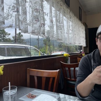 Om Thai Cuisine - Lace curtains and Mountain View corner table - Thai Near Me - Oak View, California Om Thai Cuisine - Lace curtains and Mountain View corner table - Thai Near Me - Oak View, California