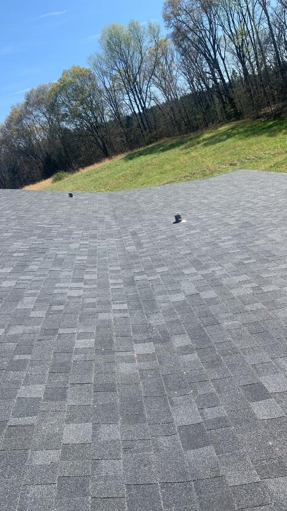 Slide of E. Thompson Roofing