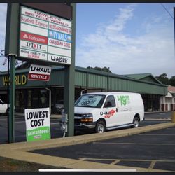 Strip mall sign & van