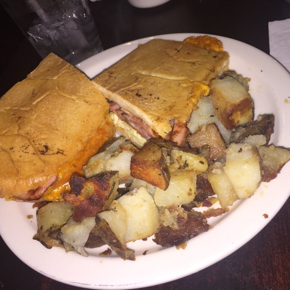 Pinky's - Simple ham-egg-cheddar Cuban pressed with side of potatoes - Coffee & Tea Near Me - Tampa, Florida Pinky's - Simple ham-egg-cheddar Cuban pressed with side of potatoes - Coffee & Tea Near Me - Tampa, Florida