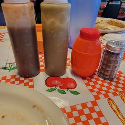 Azteca Grill - Table salsas. Very spicy and flavorful. Cute salt shakers.