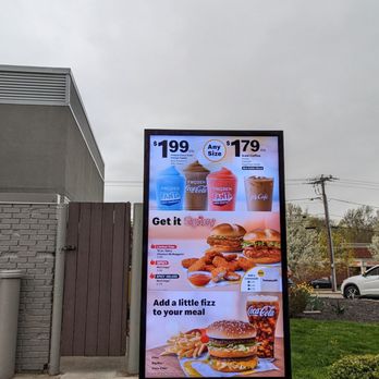 McDonald's - a menu on a sign in front of a building - Burgers Near Me - Torrington, Connecticut McDonald's - a menu on a sign in front of a building - Burgers Near Me - Torrington, Connecticut