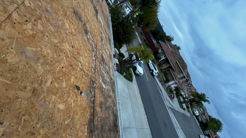 Slide of J&E Roofing Services