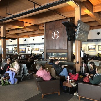 Jackson Hole Airport - JAC - Seating area with warm fireplace in the middle - Airports Near Me - Jackson, Wyoming