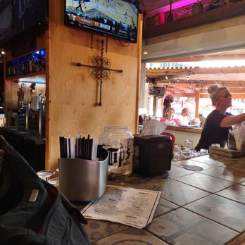 Playground Burger Bar - A view from inside to out. - Sports Bars Near Me - Galveston, Texas Playground Burger Bar - A view from inside to out. - Sports Bars Near Me - Galveston, Texas