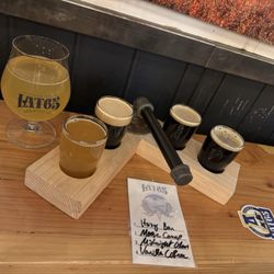 Frozen Smoke BBQ - Beer flight (from left to right): Hazy Bou, Moose Camp (nitro stout), Midnight Glow, Vanilla Coffee. Large Lat65 glass is Apeche Cider