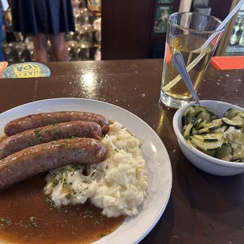Biergarten - Sausage sampler aka Wurst platte. Came with mashed potatoes and brown gravy. I subbed cucumber salad for the sauerkraut. - Wine Bars Near Me - Tucson, Arizona Biergarten - Sausage sampler aka Wurst platte. Came with mashed potatoes and brown gravy. I subbed cucumber salad for the sauerkraut. - Wine Bars Near Me - Tucson, Arizona