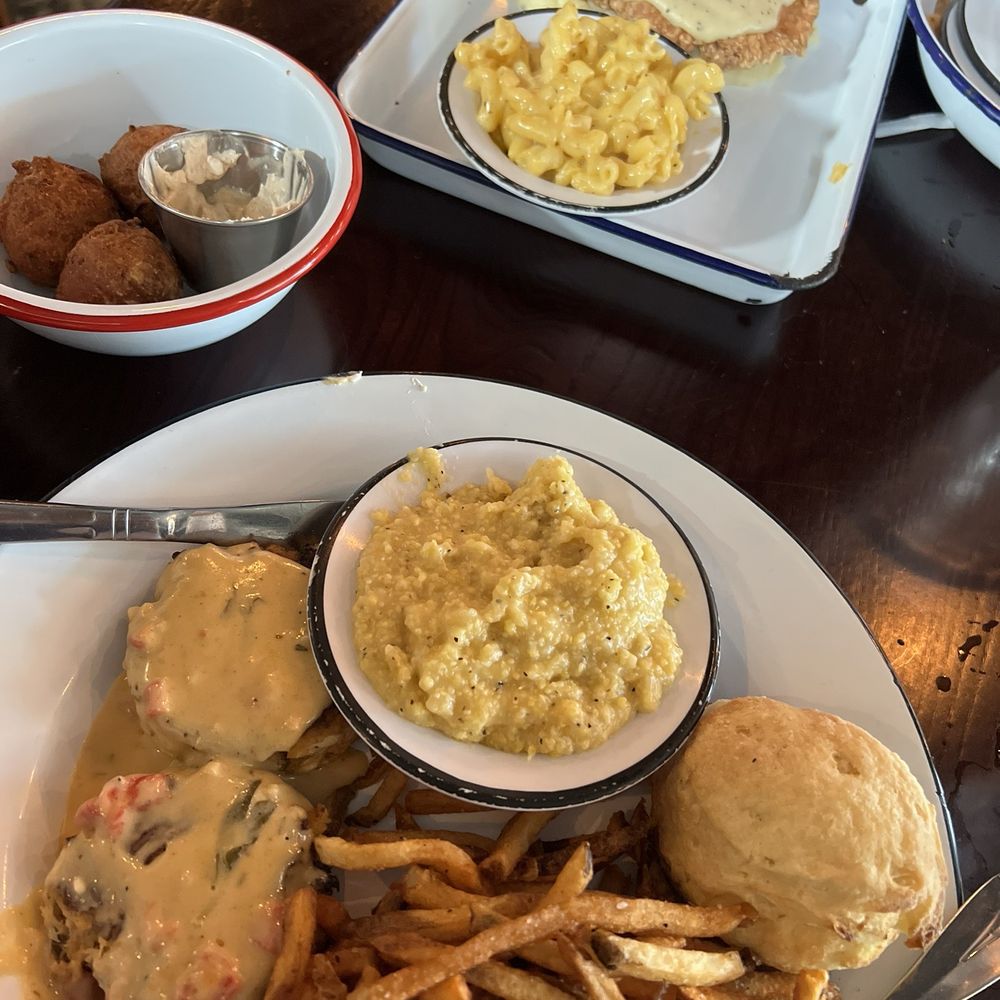 Southern Grit - Crab cake entree, country fried chicken in the background - American Near Me - Knoxville, Tennessee Southern Grit - Crab cake entree, country fried chicken in the background - American Near Me - Knoxville, Tennessee