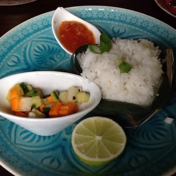 Cafe Bali - Coconut rice in A banana she'll; spicy sauce and pickled fruits. - Indonesian Near Me - Saarbrücken, SL Cafe Bali - Coconut rice in A banana she'll; spicy sauce and pickled fruits. - Indonesian Near Me - Saarbrücken, SL
