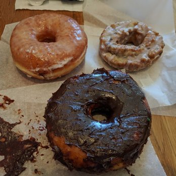 Stan's Donuts & Coffee - CW from left: plain glaze, blueberry old-fashion, and chocolate glaze (yeast) - Donuts Near Me - Chicago, Illinois Stan's Donuts & Coffee - CW from left: plain glaze, blueberry old-fashion, and chocolate glaze (yeast) - Donuts Near Me - Chicago, Illinois