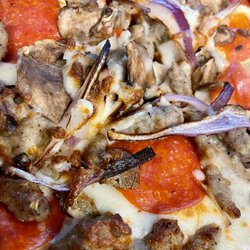 Spuds - Pepperoni, Sausage, Mushroom and Onion pizza.