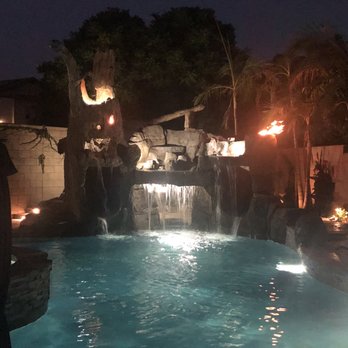 Premier Pools & Spas - Grotto/cave water feature with double slide and fire - Pool & Hot Tub Service Near Me - Ontario, California Premier Pools & Spas - Grotto/cave water feature with double slide and fire - Pool & Hot Tub Service Near Me - Ontario, California
