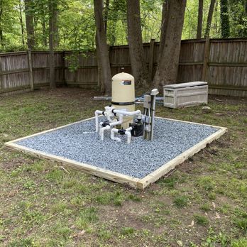 Omc Landscape - a graveled area with a water pump - Landscaping Near Me