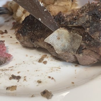 The Fort Restaurant - Lamb T-Bone with meat packing still attached - Steakhouses Near Me - Morrison, Colorado The Fort Restaurant - Lamb T-Bone with meat packing still attached - Steakhouses Near Me - Morrison, Colorado